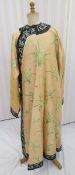 An early 20th century Chinese embroidered robe embroidered with 'noble orchids', the black borders