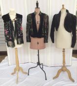 A black waistcoat made from a Chinese embroidered shawl, with fringe detail and a large covered