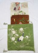 An Edwardian silk padded cover, embroidered with a crane amongst cherry blossom on a green silk
