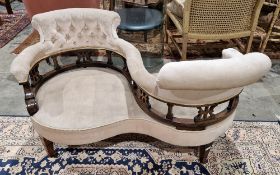 Victorian walnut two-seater conversation seat/love chair having button pale brown fabric