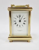 20th century gilt brass cased carriage clock, the white enamel face with Roman and Arabic