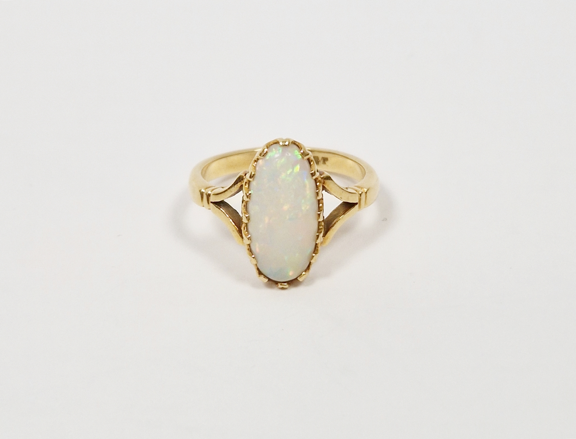 18ct gold and opal ring set oval claw set stone (size N1/2)  Condition Report approx weight is 4.0g