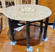 Persian brass tray top folding table, the brass tray top with central fluted well surrounded by a