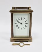 French gilt brass cased carriage clock, with bevelled edge glass panels, the white enamel face
