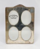 Modern silver easel photograph frame, with four oval apertures, hallmarked London 2003 by Kitney &