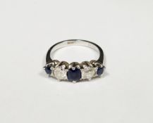 Sapphire and diamond five stone platinum ring, three oval mixed cut sapphires, the central