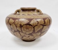 Large modern terracotta jardiniere/pot with leaf decoration on a brown ground and four handles to