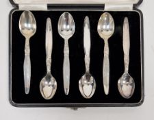 Set of six Indian white metal teaspoons, each stamped silver to underside, the handles with engraved