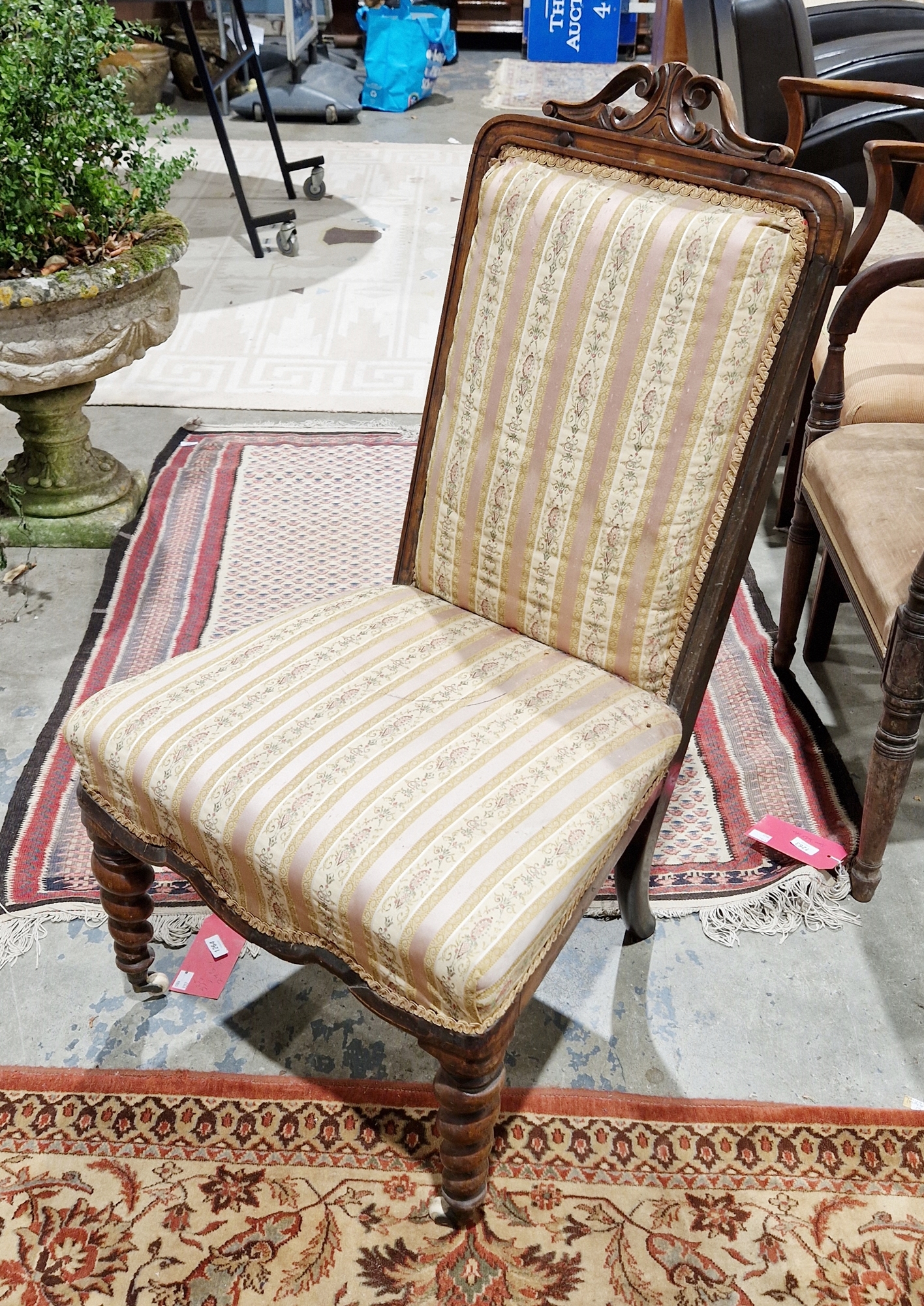 19th century rosewood framed side chair, the top rail with a scrolling carved pediment, the back and