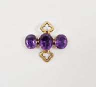 19th century amethyst brooch, composed of three oval mixed cut amethysts in a yellow metal claw