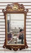 Mahogany and parcel-gilt framed fretwork carved hanging wall mirror in the George III manner, the