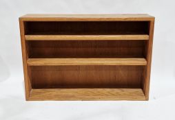 Contemporary oak dwarf bookcase with two adjustable shelves, 122cm long x 25cm deep x 84cm high