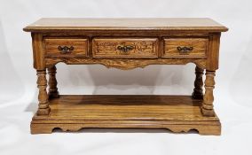American Virginia House oak dresser base with three drawers over a pot shelf below and raised on