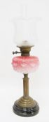 Victorian brass oil lamp, with fluted opaque etched glass shade, moulded pink glass reservoir and