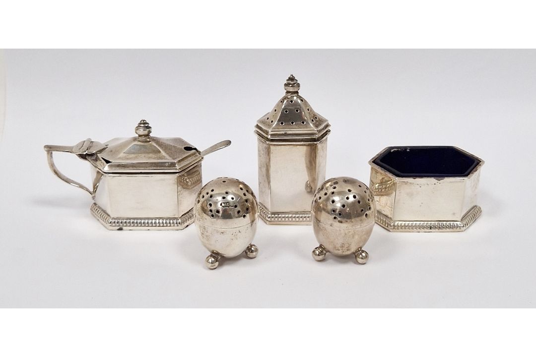 Silver three piece cruet set, Birmingham 1929, Adie Bros, each piece of elongated hexagonal form