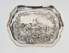 Edwardian silver dressing table tray, rectangular with serpentine borders, repousse with children