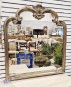 Modern overmantel mirror with c-scroll moulded frame with silvered finish, 102cm wide x 114cm high