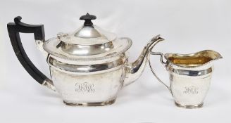 Edwardian silver teapot with matching silver cream jug, each with engraved monogram to front,