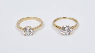 Two 9ct gold and cubic zirconia solitaire single stone rings (sizes R and P1/2)
