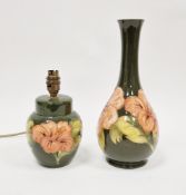 Moorcroft pottery vase, baluster-shaped, green ground and with Coral Hibiscus tubelined