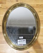 Early 20th century gilt brass framed oval mirror, 47cm x 37cm