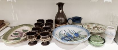 Jersey pottery brown glazed water jug and eight footed goblets, impressed with a band of circles,