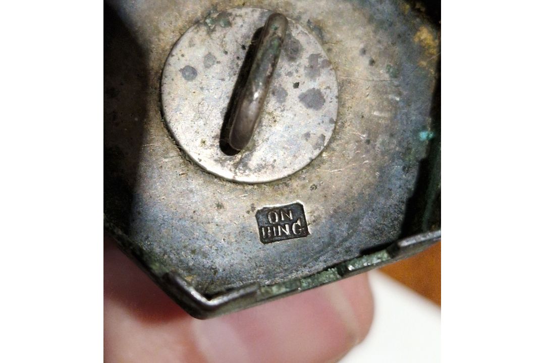 Pair of Chinese white metal pepperettes in the form of pagodas stamped ' On Hing ' to base, 7cm high - Image 3 of 4