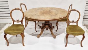 Victorian walnut inlaid tilt-top loo table, the oval top raised on a carved baluster support and