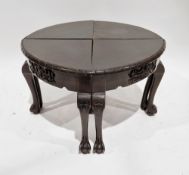 Set of four South East Asian small tables sitting together to form one larger circular table, each
