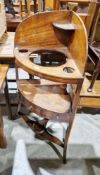 George III mahogany bowfront corner washstand, the galleried top with recesses for bowls, above a