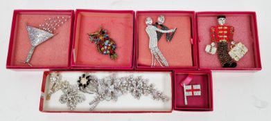 Six Butler & Wilson costume jewellery brooches including boxed bell boy, boxed dancing couple, boxed