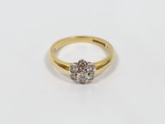 18ct gold and diamond flowerhead ring, the seven stones in rubover settings (size N)  Condition