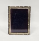 Silver rectangular photograph frame, London 2020, plain with a reeded edge and easel back, 21cm x