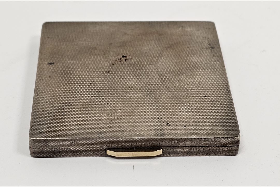 Silver compact, Birmingham 1947, maker F.G, of square form with engine turned decoration, gold- - Image 1 of 2