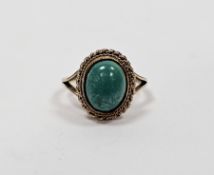 9ct gold and turquoise cabochon ring set single oval stone with rope twist surround. Ring size I,