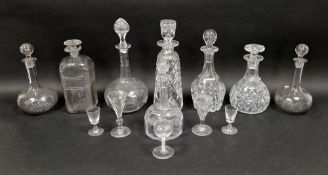 Collection of cut-glass decanters and stoppers and drinking glasses, including: a 19th century