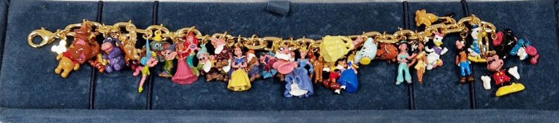 Walt Disney charm bracelet with multiple enamelled Disney character charms, with certificate and box