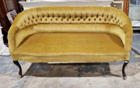 19th century olive green upholstered buttonback settee with curved back and raised on front cabriole