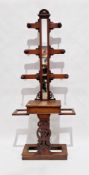 Victorian mahogany six-branch hall stand with central mirror and turned wooden hooks, glove