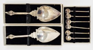 Two white metal hand-made replica utensils and a set of six white metal replica utensils, all