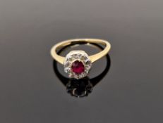 18ct gold, diamond and ruby ring set small oval ruby surrounded by old cut diamonds (some wear)