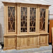 19th century pine breakfront library bookcase, the central section with a pair of astragal glazed