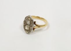 18ct gold and diamond dress ring, elliptical, set old cut stones, the two centre cushion-shaped each