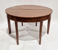 Pair of George lll mahogany demi-lune tables with plain frieze and raised on square tapering legs,