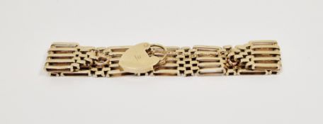 9ct gold five bar gate-pattern bracelet with a 9ct gold padlock fastener on a fine chain,