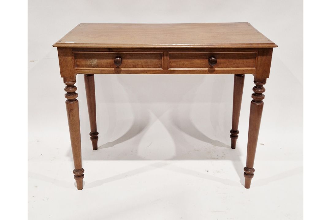 Victorian mahogany side table, the top with moulded edge above two frieze drawers and raised on