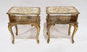 Pair of Italian Florentine-style bedside tables with a gilt and cream finish, each comprising an