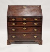 George III oak bureau, with sloping fall front over four long graduating drawers having brass swan