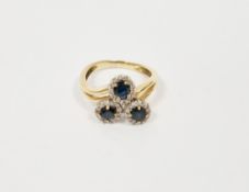 18ct gold, sapphire and diamond triple cluster ring set three sapphires surrounded by small diamonds