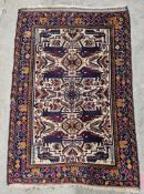 Caucasian wool rug with pairs of lions on an ivory ground with stylised flowers, trailing floral